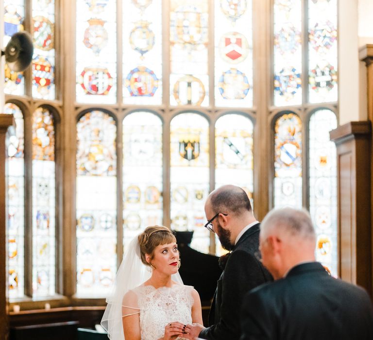 Wedding Ceremony Bride in Lace San Patrick Gown &amp; Veil | Groom in Tweed Chester Barrie Suit | Candle Lit Christmas Wedding at Gray's Inn London with Christmas Carols &amp; Festive Wreaths | John Barwood Photography