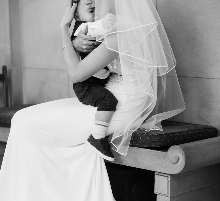 Bride in Lace San Patrick Gown and Son | Candle Lit Christmas Wedding at Gray's Inn London with Christmas Carols &amp; Festive Wreaths | John Barwood Photography