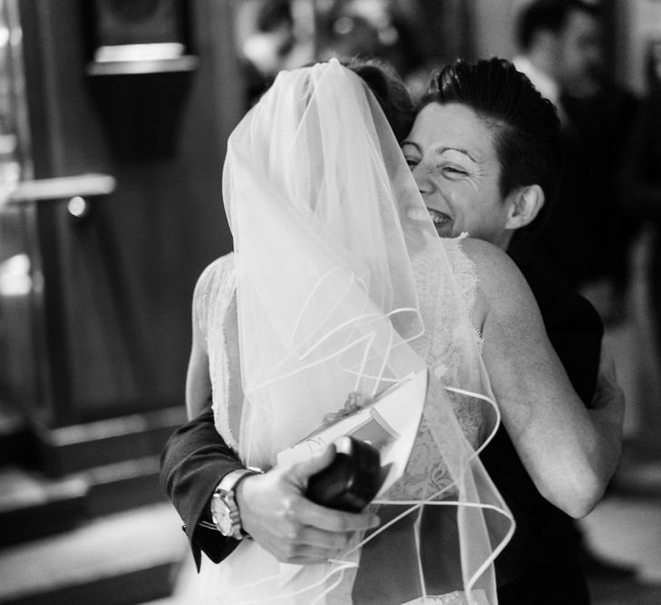 Bride in Lace San Patrick Gown &amp; Veil | Candle Lit Christmas Wedding at Gray's Inn London with Christmas Carols &amp; Festive Wreaths | John Barwood Photography