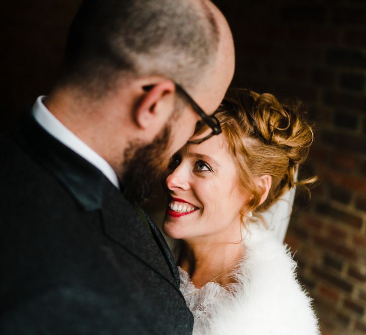 Bride in Lace San Patrick Gown &amp; Fur Coverup | Groom in Tweed Chester Barrie Suit | Candle Lit Christmas Wedding at Gray's Inn London with Christmas Carols &amp; Festive Wreaths | John Barwood Photography