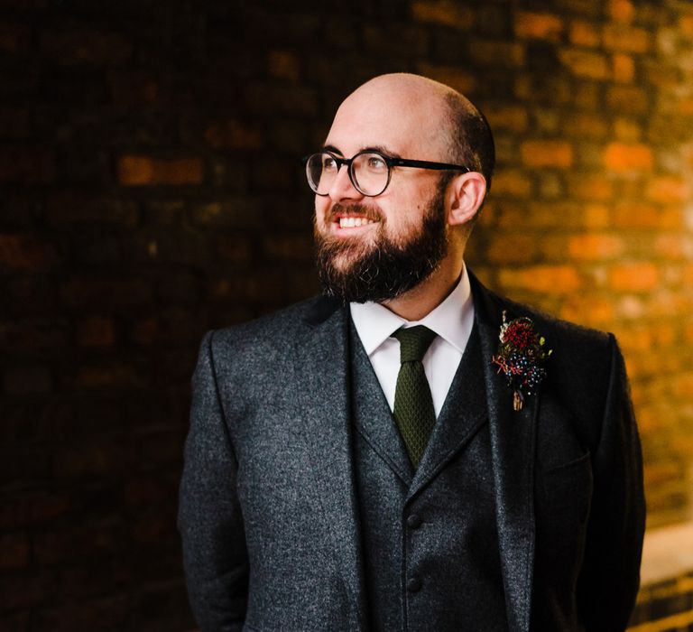 Groom in Tweed Chester Barrie Suit | Candle Lit Christmas Wedding at Gray's Inn London with Christmas Carols &amp; Festive Wreaths | John Barwood Photography