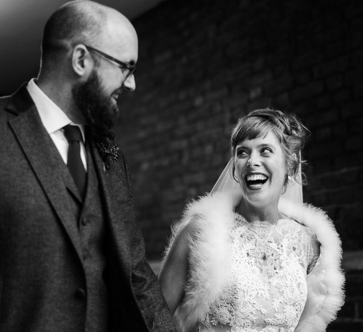 Bride in Lace San Patrick Gown &amp; Fur Coverup | Groom in Tweed Chester Barrie Suit | Candle Lit Christmas Wedding at Gray's Inn London with Christmas Carols &amp; Festive Wreaths | John Barwood Photography