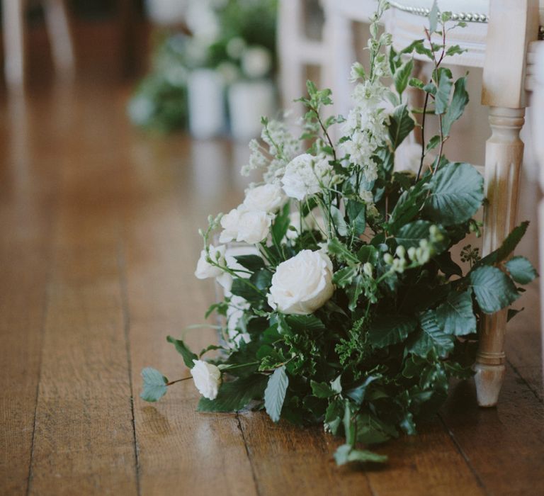 Ceremony flowers at Kirtlington Park wedding