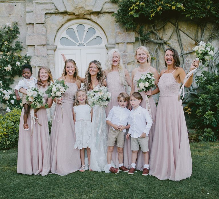 Pink bridesmaid dresses with page boys