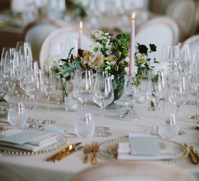 Candles and flower centrepieces at Kirtlington Park wedding