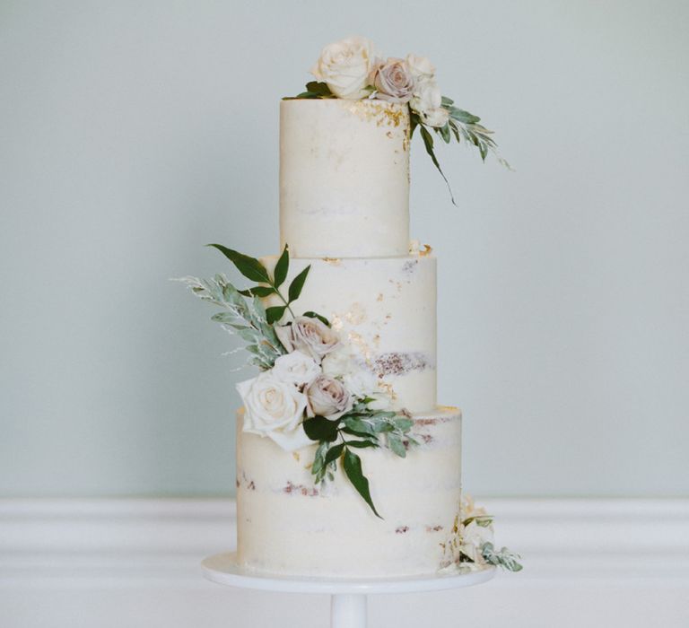 Semi-naked wedding cake with flower decor