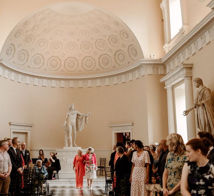 Mother of the Grooms walking down the aisle