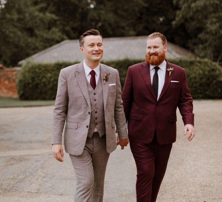 Same sex couple in burgundy and checked suits