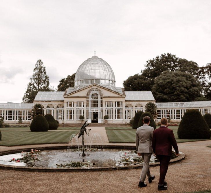 Mr &amp; Mr walking through Syon Park grounds towards the conservatory