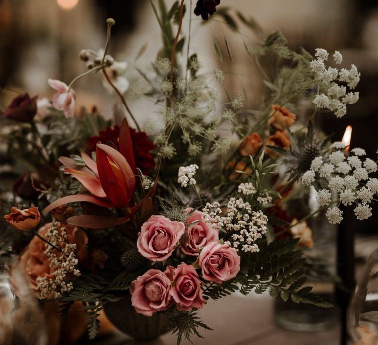 blush pink and orange autumnal wedding flower centrepieces