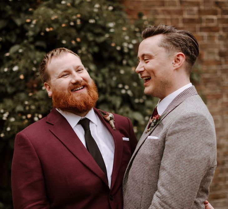 Wedding portrait of groom and groom laughing