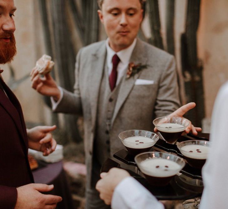 Groom and groom enjoying expresso martini cocktails at Syon Park wedding