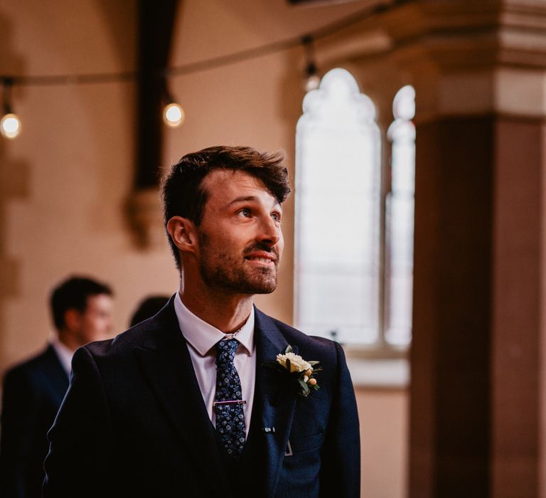 Groom standing at the altar