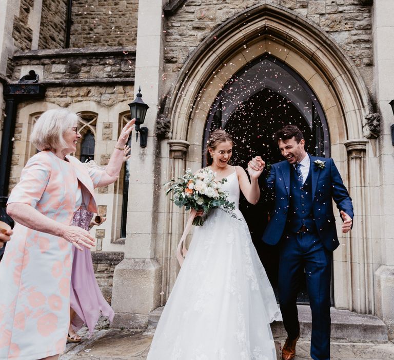 Bride and groom church confetti exit at 2020 wedding