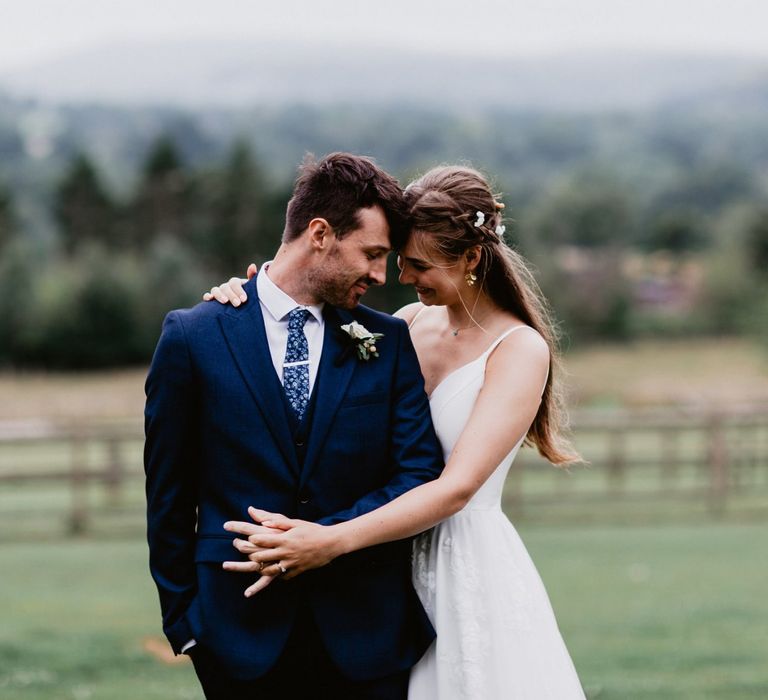 Bride hugging her groom