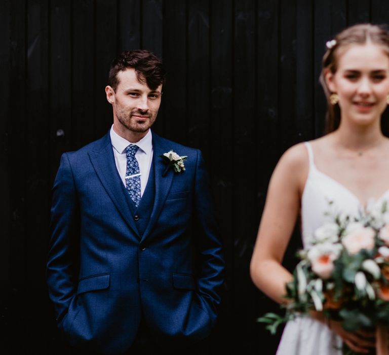 Wedding photography with groom in focus