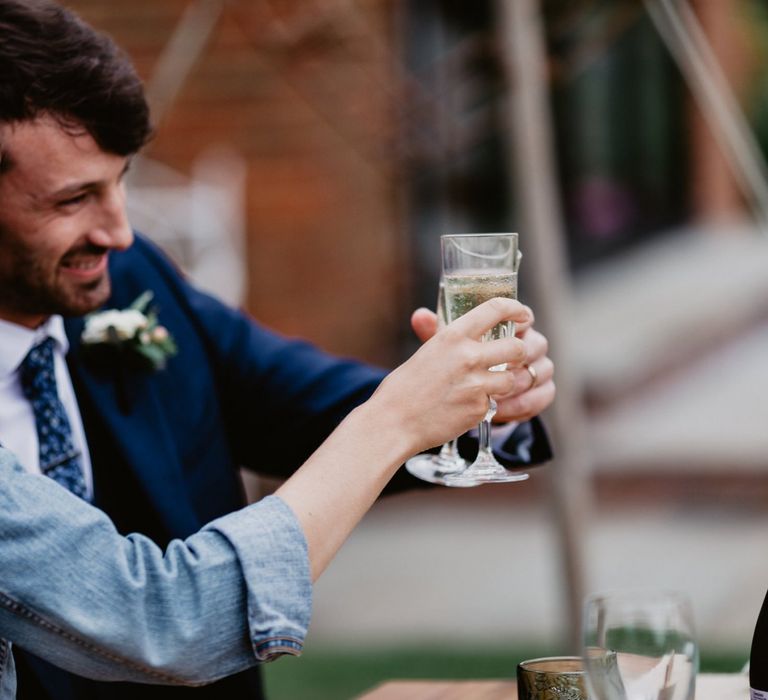 Bride and groom toasting at intimate wedding