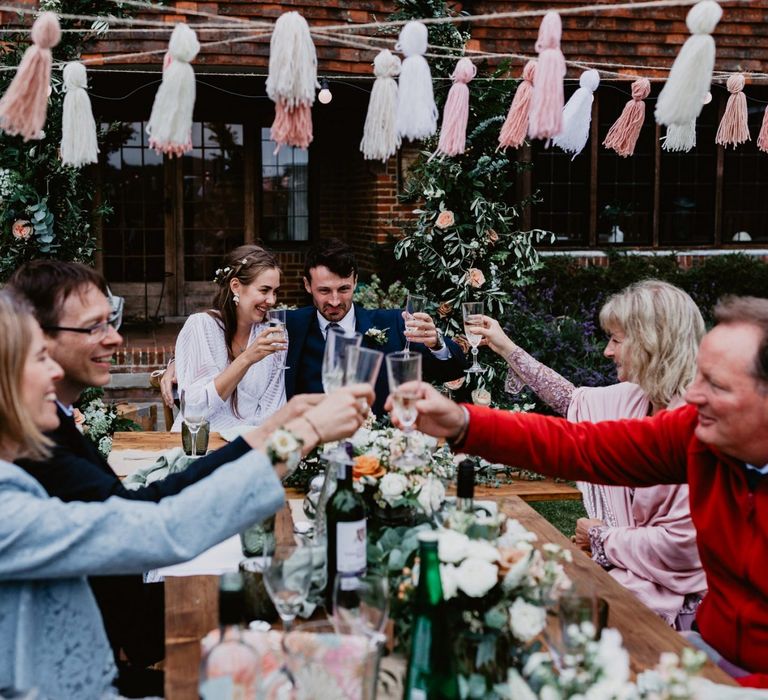 Wedding guests toast at 2020 wedding