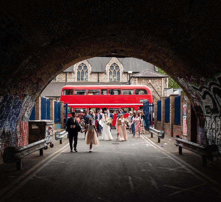 Wedding Guests Getting off the Red Double Decker Bus Wedding Transport