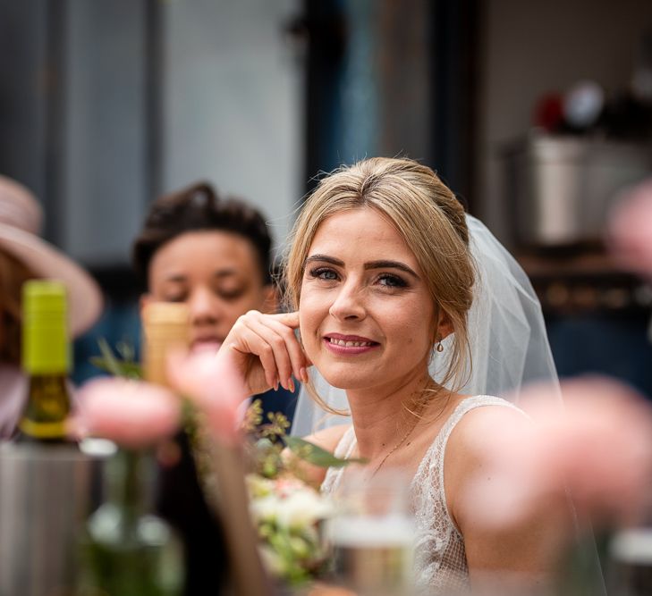 Beautiful Bride Smiling at Wedding Reception Speeches