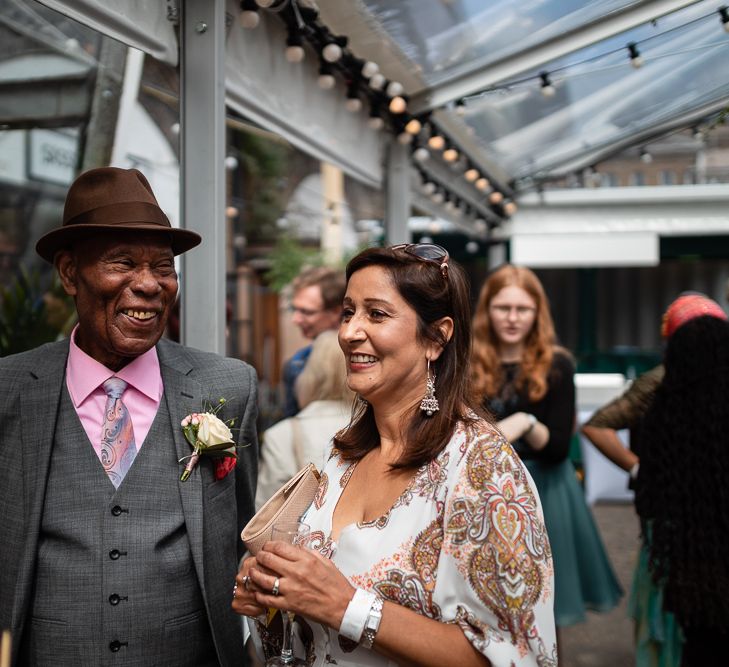 Wedding Guests Smiling During Evening Reception