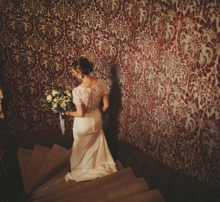 Bride in Sarah Seven wedding dress making her way to the ceremony