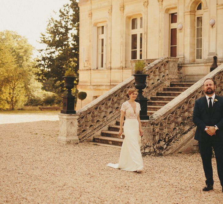 Bride in Sarah Severn wedding dress at First Look