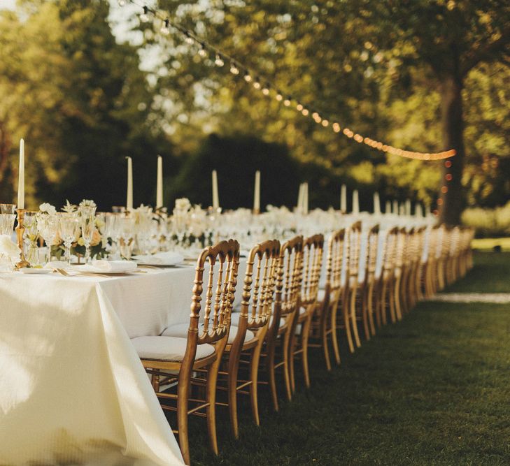 Simple white and gold decor for wedding breakfast in France