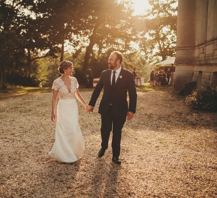 Bride in Sarah Seven wedding dress with groom