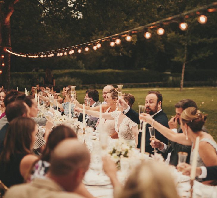 Wedding guests toast the special day