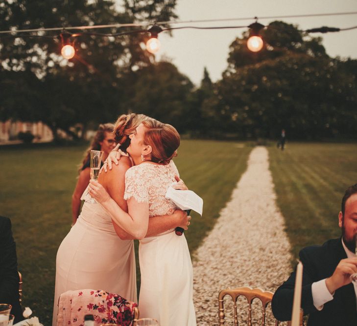 Bride hugs wedding guests