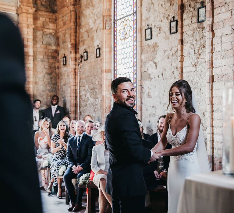 Bride and groom exchange vows in small church in Tuscany