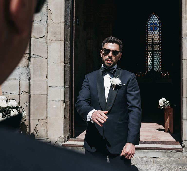 Groom in tuxedo for black and white wedding