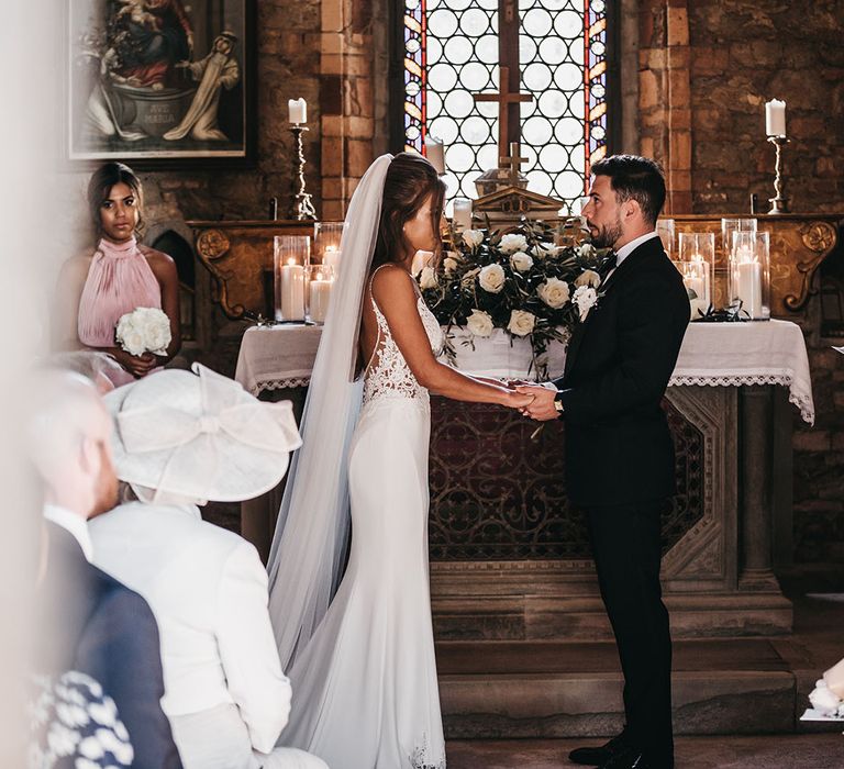 Bride and groom say I do in church