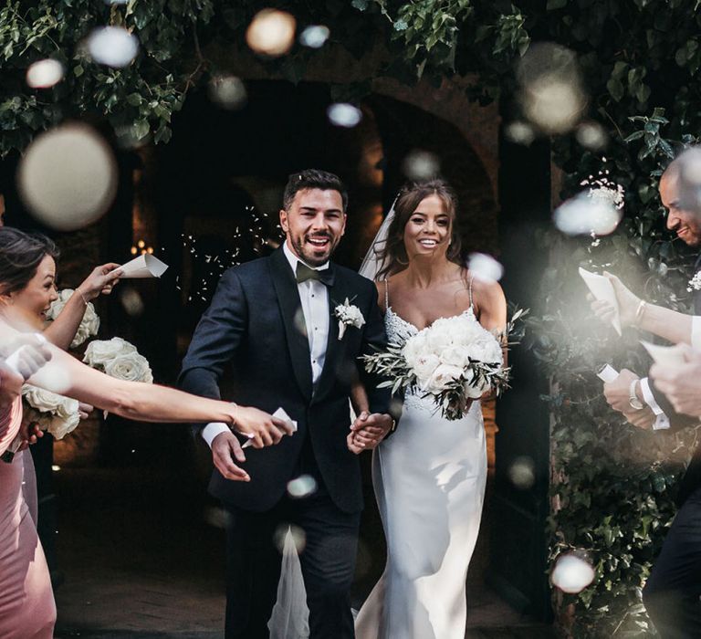 Confetti exit for couple in Tuscany