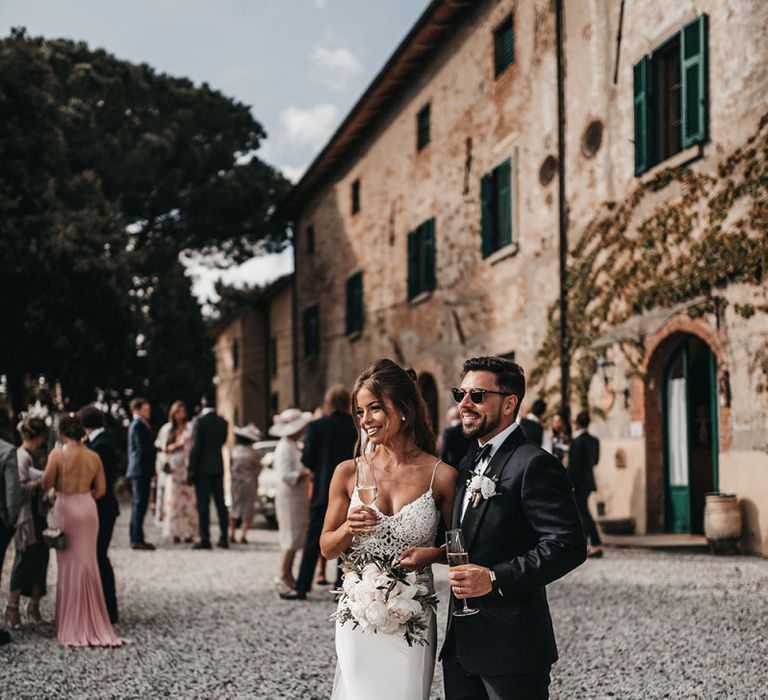 Bride and groom take a moment at Italian black and white wedding