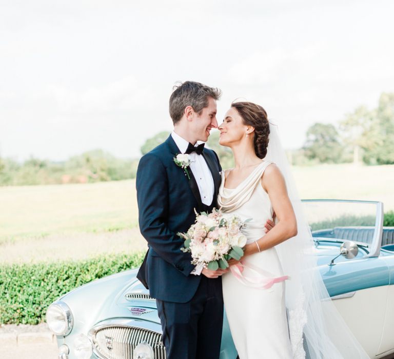 Groom in black tuxedo for black tie wedding