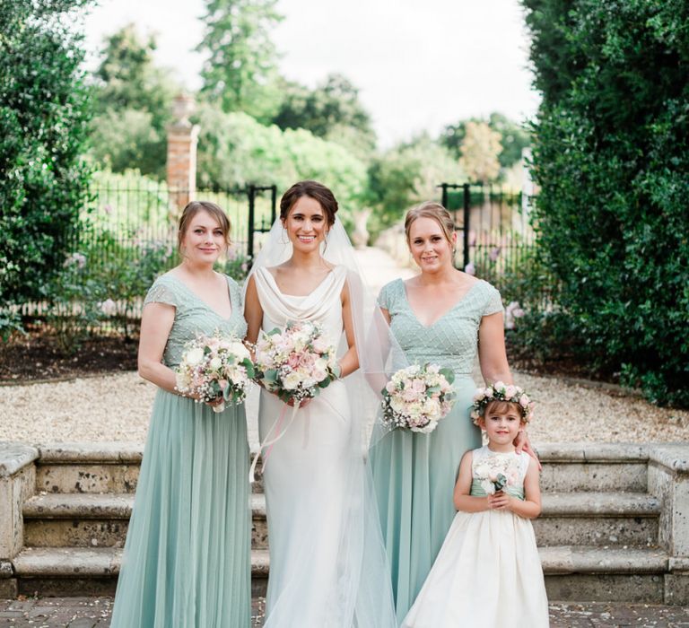 Bridesmaids and flower girl with blush bouquets