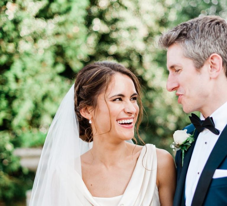 Bride with pinned undo at black tie wedding