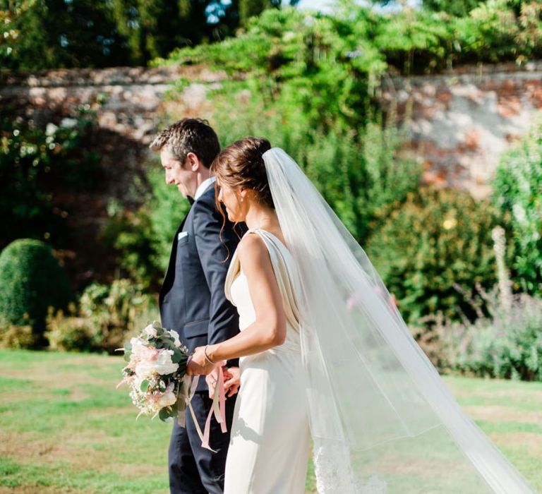 Lace trim veil for bride with updo