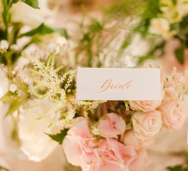 Pink wedding flowers and place setting