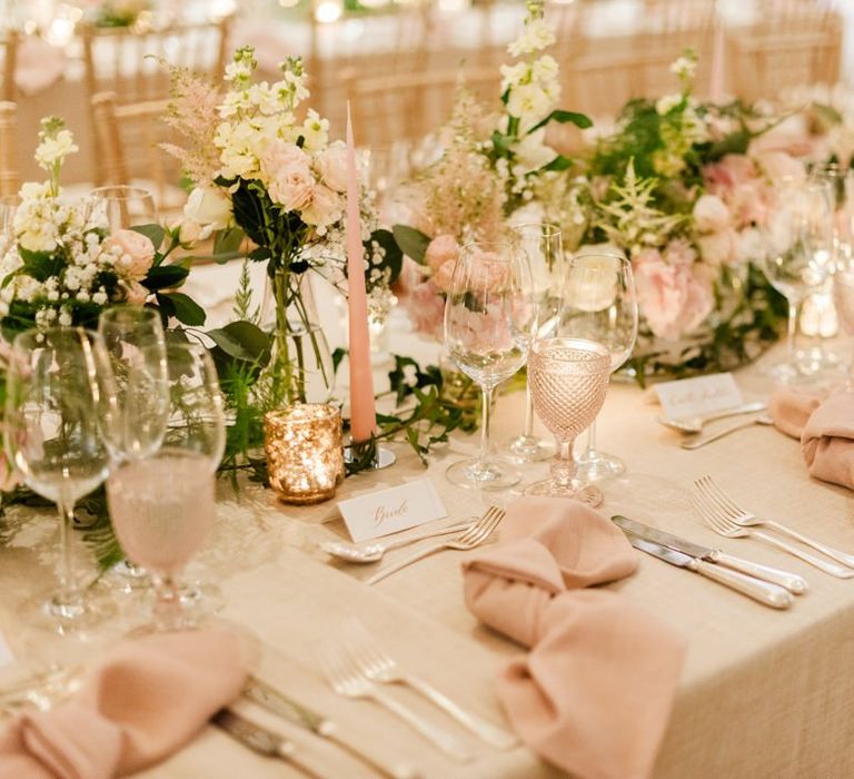 Pink napkins and flowers for Four Seasons Hampshire wedding breakfast