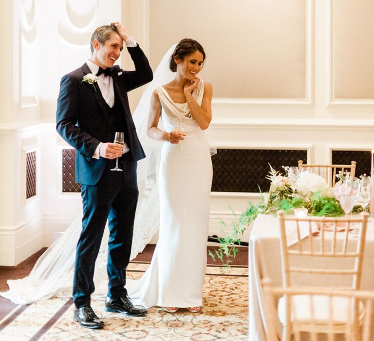 Bride and groom enter the room