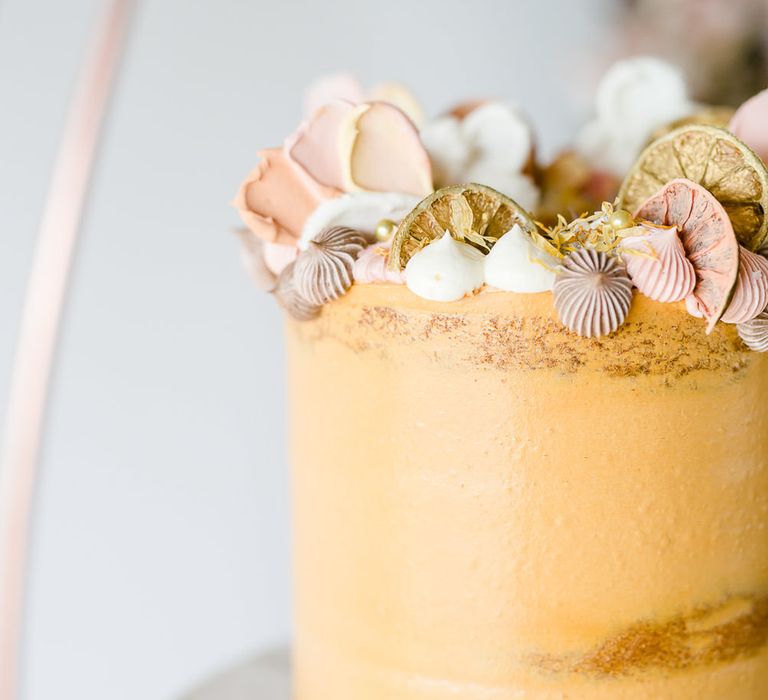 Golden Wedding Cake With Shell Details // Environmentally Conscious Wedding Venue Casterley Barn In Wiltshire Organic Working Farm Stylish Barn Wedding Venue Images Lydia Stamps