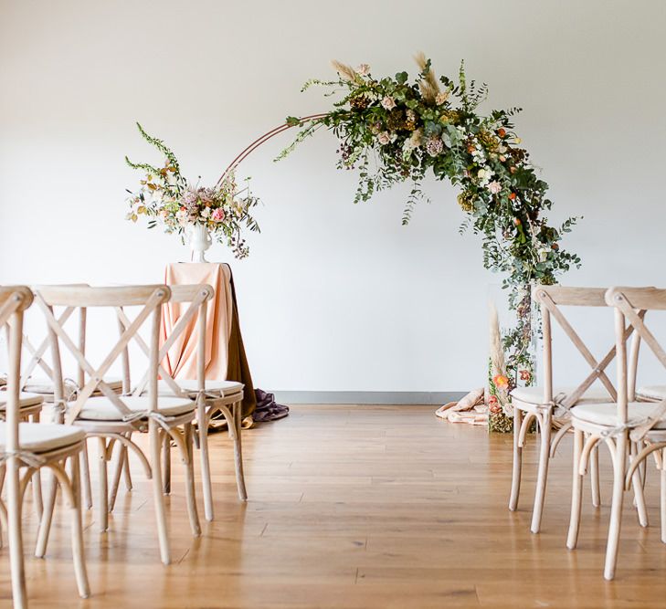 Elegant Pastel Modern Wedding Inspiration With Floral Arch Ceremony Backdrop // Environmentally Conscious Wedding Venue Casterley Barn In Wiltshire Organic Working Farm Stylish Barn Wedding Venue Images Lydia Stamps