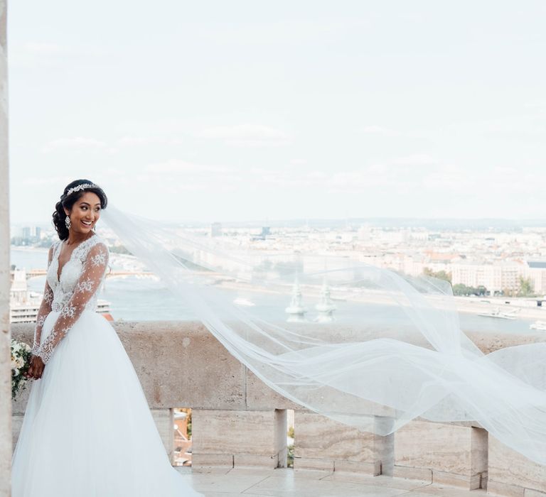 Bride in Pergola Rosa Clara Princess Wedding Dress and Groom in Traditional Morning Suit