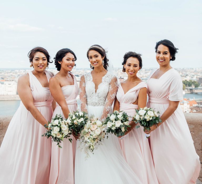 Bridal Party Portrait with Bridesmaids in Pink Multiway Dresses and Bride in Pergola Rosa Clara Princess Wedding Dress