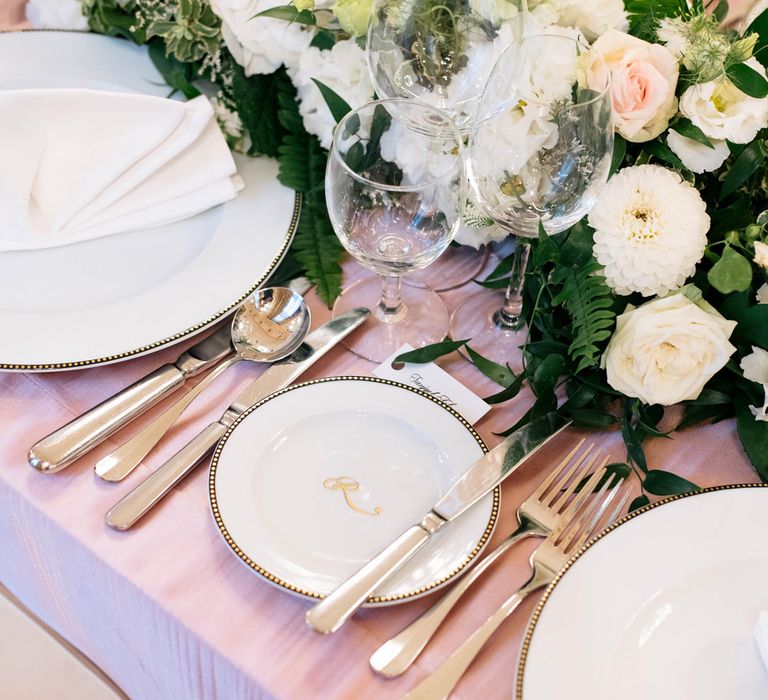 Elegant Place Setting with Fine china and White Floral Arrangements