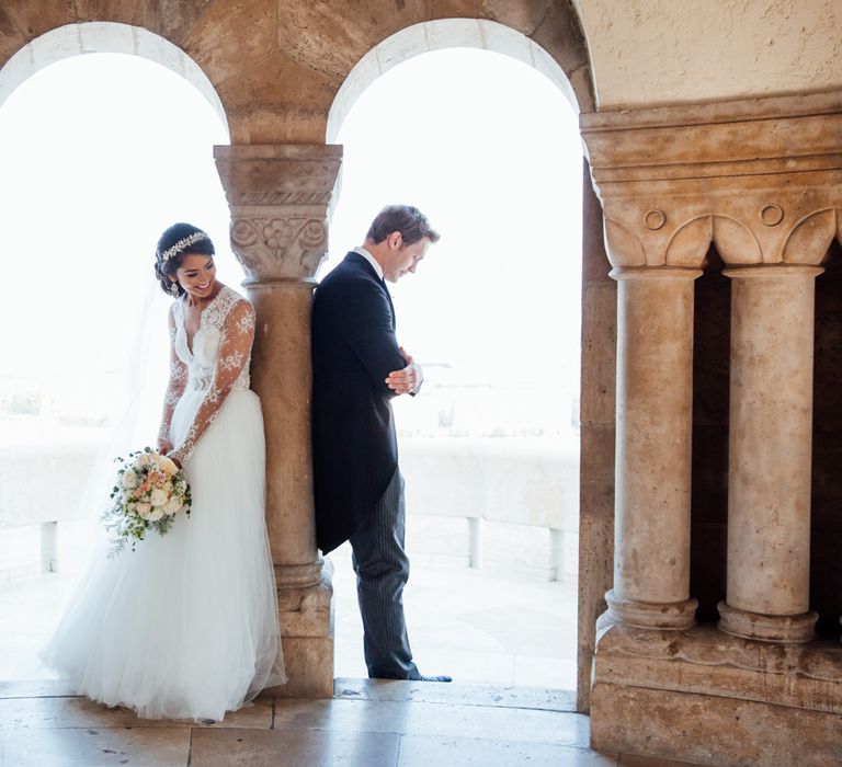 Bride in Pergola Rosa Clara Princess Wedding Dress and Groom in Traditional Morning Suit