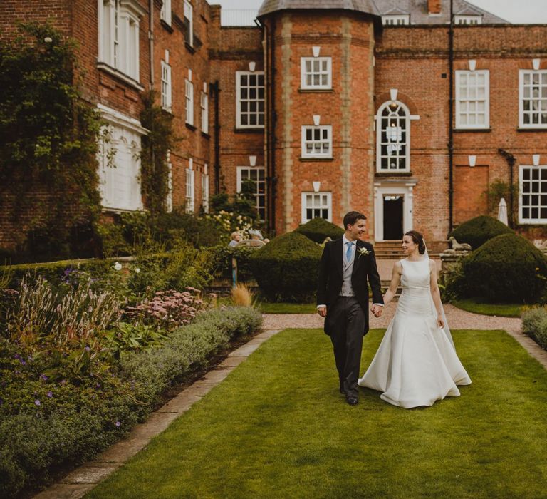 Bride and groom portrait in front of Shropshire wedding venue, Iscoyd Park